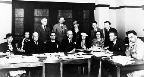 Delegates to the League of Nations Union Annual Meeting and Conference, Canberra, 28 to 31 January 1938. Seated (left to right): O Smith (Tas); L Littlejohn (NSW); WA Woods (Tas); Rev Norman Lade (SA); FE Barraclough (NSW); Ruby Rich (NSW); Constance Duncan (Vic); Sir Robert Garran (President); W Macmahon Ball (Vic); Standing (left to right): Captain F O'Sullivan (Qld); RJF Boyer (Qld); MM Rischbieth (WA); Professor Fred Alexander (WA); and Ray Watt (NSW). [National Library of Australia]