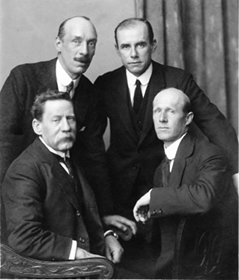 The Australian delegation to the First Assembly of the League of Nations, Geneva, 1920. Front (left to right): Senator ED Millen (delegate); JR Collins (Secretary to the Treasury, adviser); Back: P Hunter (adviser); GS Knowles (Attorney-General's Department, adviser)