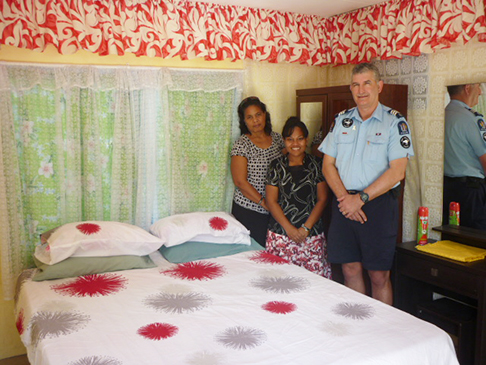 dvso staff and police officer standing next to a bed