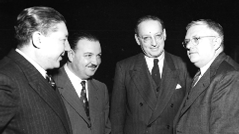 Members of the Chilean delegation chat informally with the Australian Minister for External Affairs and Attorney-General, and leader of the Australian delegation, Dr Herbert V Evatt, United Nations, New York, October 1947. Left to right: Rodrigo Aburto; Amilcar Chiorrini (deputy delegation leader); Senator José Maza (delegation leader); and Dr Evatt. [UN Photo]