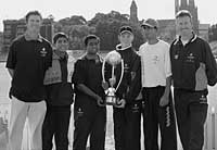 Cricketers holding trophy