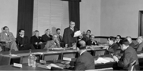 The Australian Attorney-General and Minister for External Affairs, and deputy leader of the Australian delegation, Dr Herbert V Evatt, presents Australia's position in the Sub-Committee on Regional Arrangements, San Francisco, 21 to 22 May 1945. Seated at table, facing (left): Francisco Castillon Nájera, (Mexico); (right) Fausto Soto and German Vergara (Chile). [UN Photo/Mili]