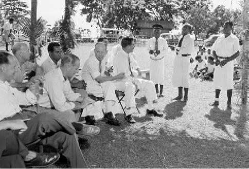 Members of the UN Trusteeship visiting mission to Papua and New Guinea and Nauru speaking with Kupas, Chief Luluai Ainuai and interpreter Robin Mariot, Raluana, 1956. Left to right: J Rolz Bennett (Guatemala); J Lewis (secretary); ME Chacko (India); Sir John McPherson (United Kingdom, chairman); and K Roberts (Native Affairs). [National Archives of Australia]