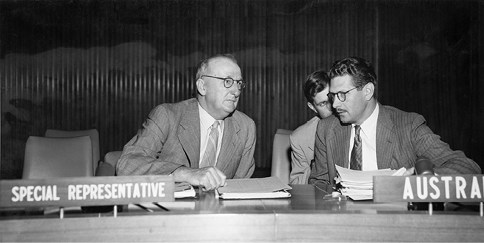 The Australian Special Representative on the Trusteeship Council for Papua and New Guinea, John H Jones (left), and First Secretary, Australian Permanent Mission to the United Nations, Allan H Loomes, during the Trusteeship Council general debate on the report on the UN Trust Territory of Papua and New Guinea under Australian administration, New York, 1953. [National Archives of Australia]