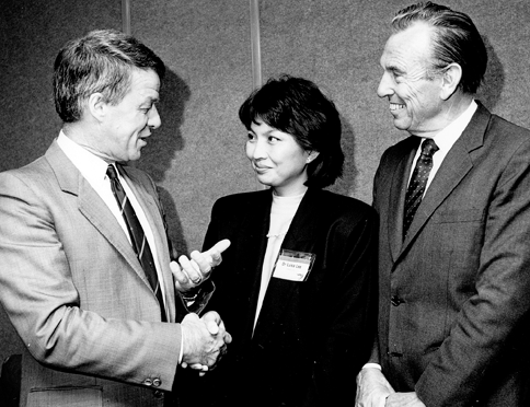 The Australian Minister for Health, Dr Neal Blewett (left), talks with the Medical Director, Singapore, Dr Luisa Lee (centre), and the Director-General of the World Health Organization, Dr Halfdan Mahler (right), at the 2nd International Conference on Health Promotion, Adelaide, South Australia, 5 to 9 April 1988. [National Library of Australia]