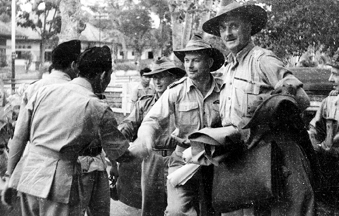 Australian military officers are greeted by local officials at Djokjakarta (Yogyakarta), 14 September 1947—the first military observers requested by the Consular Commission established by the Security Council on 25 August 1947 to arrive in the Netherlands East Indies. [National Library of Australia]