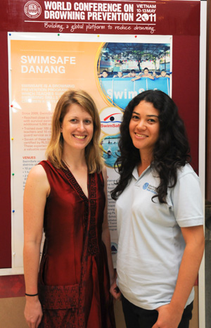 2 women in front of banner