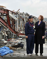 Photo of Prime Minister Julia Gillard inspecting tsunami damage in Minami
