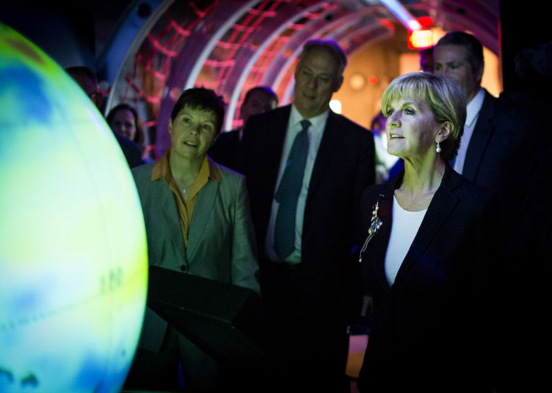 Julie Bishop looking at colourful globe
