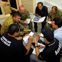 Photo of officials in a huddle meeting