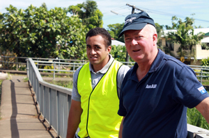 Australian structural engineer, ACC specialist Peter Bowman and LTA representative, Azriel Sofe examine Leone bridge