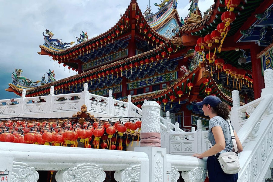 Photo of Adelaide Pope exploring Malaysia's historical streets and buildings. 