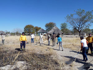 People with tools practicing fire management skills