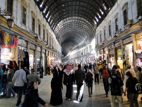 Many people in a grand indoor shopping hall