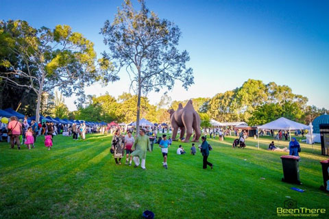 People walking around show grounds.