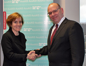 Ms Albright and Mr Baxter shaking hands
