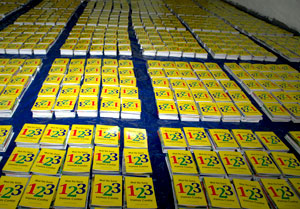 Piles of books being readied for distribution.