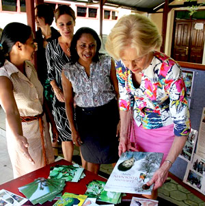 The Governor-General looking at a Tetum language book.