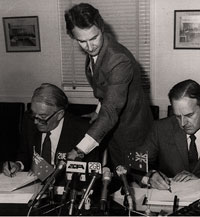 Vintage photo of two ministers signing an agreement