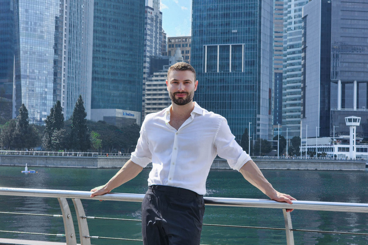 Portrait of Anton Lucanus with Singapore buildings in the background. 