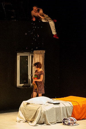 Artist performing on stage.