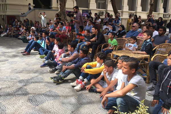 Photo of an audience watching a performance.