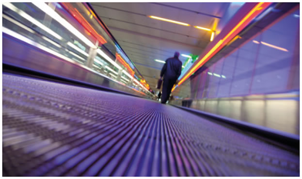 Picture of man with briefcase on travelator