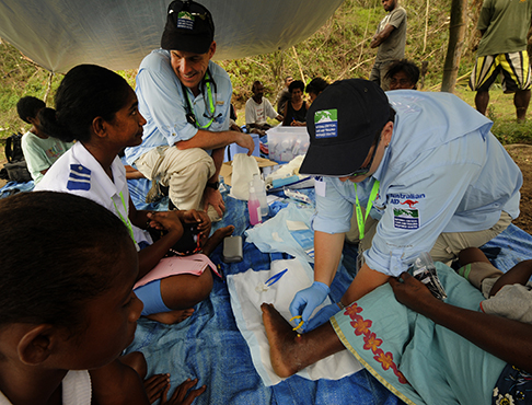 Group of medical professionals working on patients