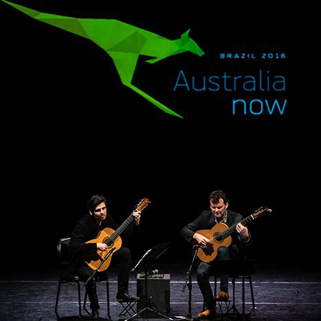 Guitarists performing on stage