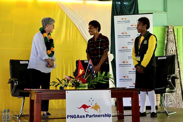 Photo of Senator Wong speaking with participants of the PNG Aus Partnership Secondary Schools Initiative on stage in panel discussion. 