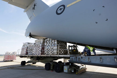 Photo of Aid supplies being loaded onto a plane from earthquake victims in Indonesia