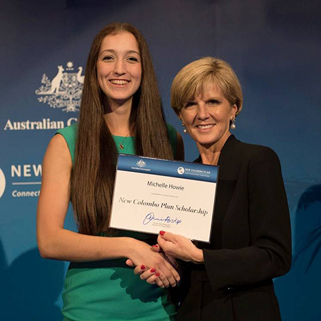 Michelle Howie receiving a certificate from Foreign Minister Bishop