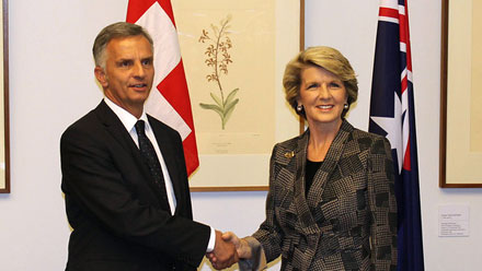 Foreign Minister Julie Bishop and Swiss Foreign Minister Didier Burkhalter shake hands.