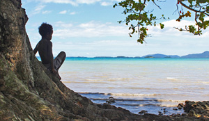 boy looking over sea