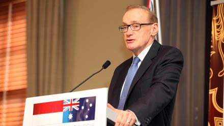 Foreign Minister Carr standing at a podium speaking