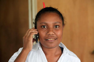 A woman holding a mobile phone to her ear