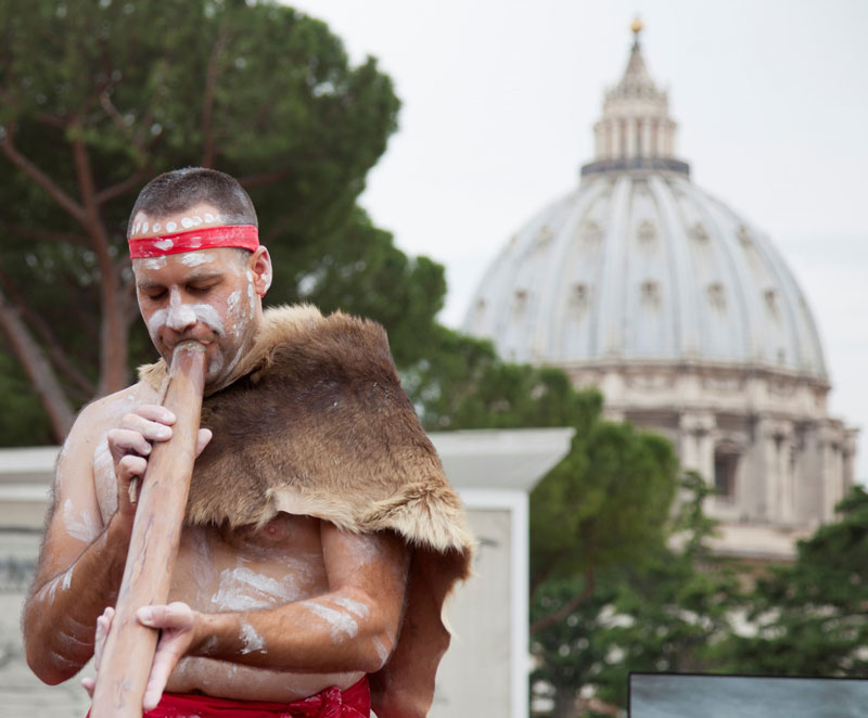 Photo of Chris Williams performing with his didgeridoo at the Vatican Anima Mundi Museum Australia Catalogue Launch