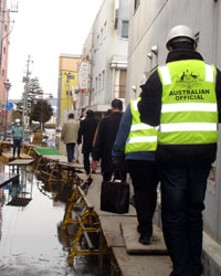 Photo of Australian officials assisting the Tsunami area in Japan
