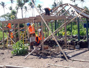 APTC students rebuilding a house
