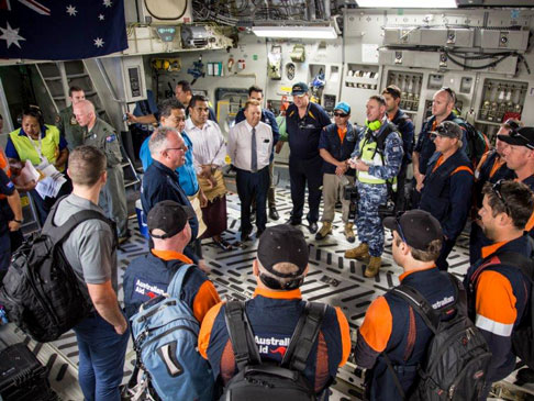 Australian aid staff gethered in a circle.