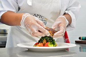 Chef plating a meal