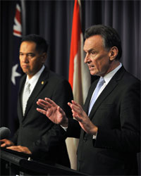 Craig Emerson and Gita Wirjawan addressing a press conference