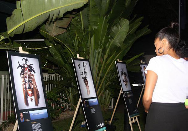 Photo of people browsing the outdoor art exhibition.