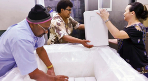 People Unpacking the FHSSP Vaccine in Fiji