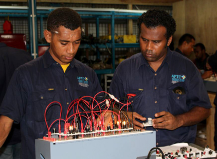 Two men looking at an electronic device