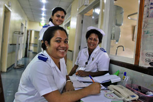 Three nurses smiling at camera