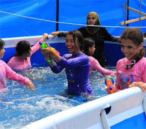 Girls playing in a pool