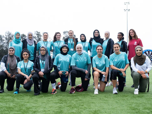 Group photo of a Girls Football Team.