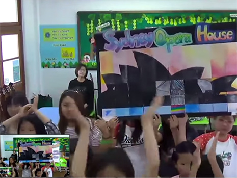 Children holding signs up to the camera