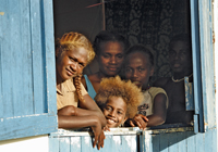 Photo of a family look out from the window
